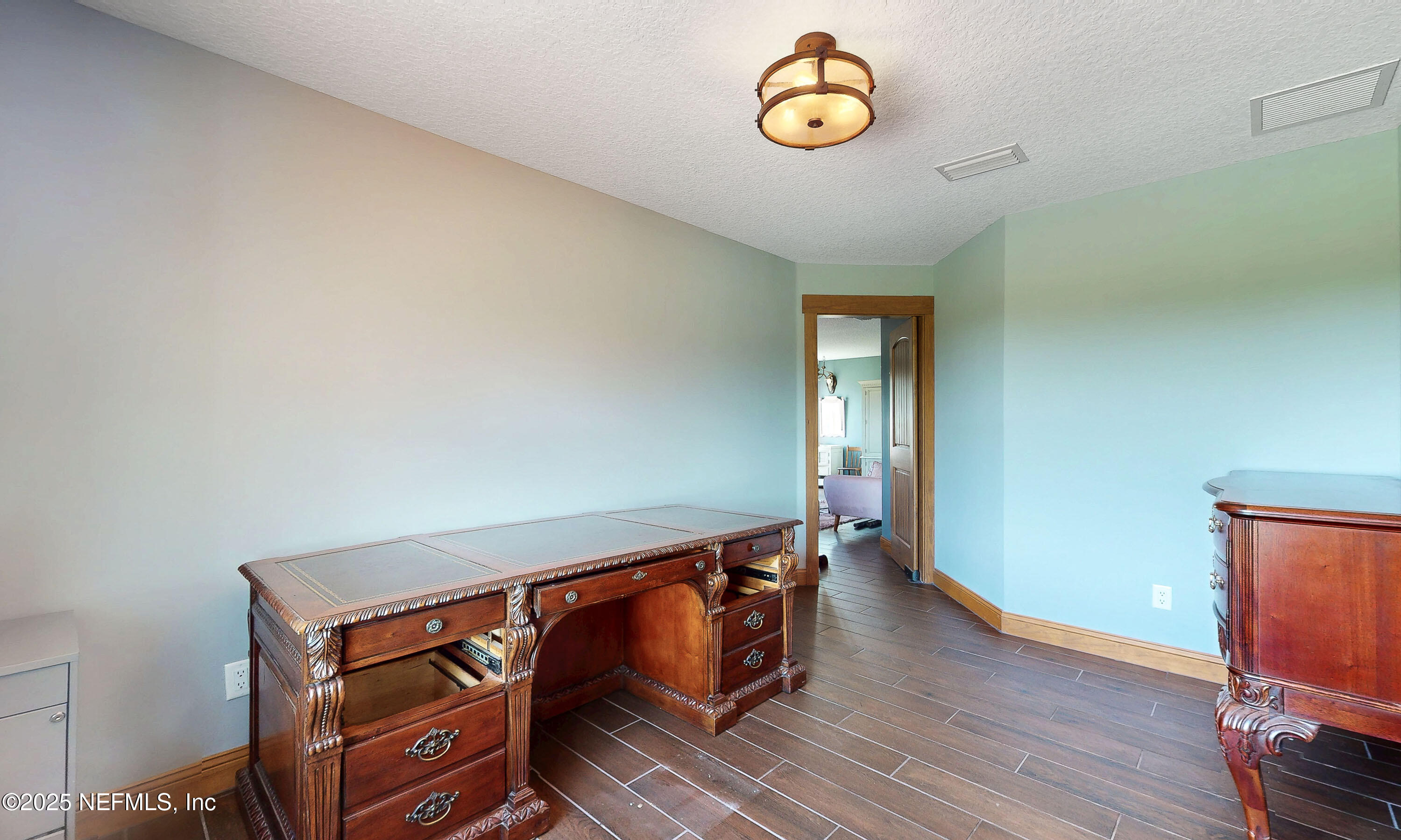 1845 Kinard Road Bryceville, FL 32009 - Photo 28 of 86 an empty room with wooden floor and windows
