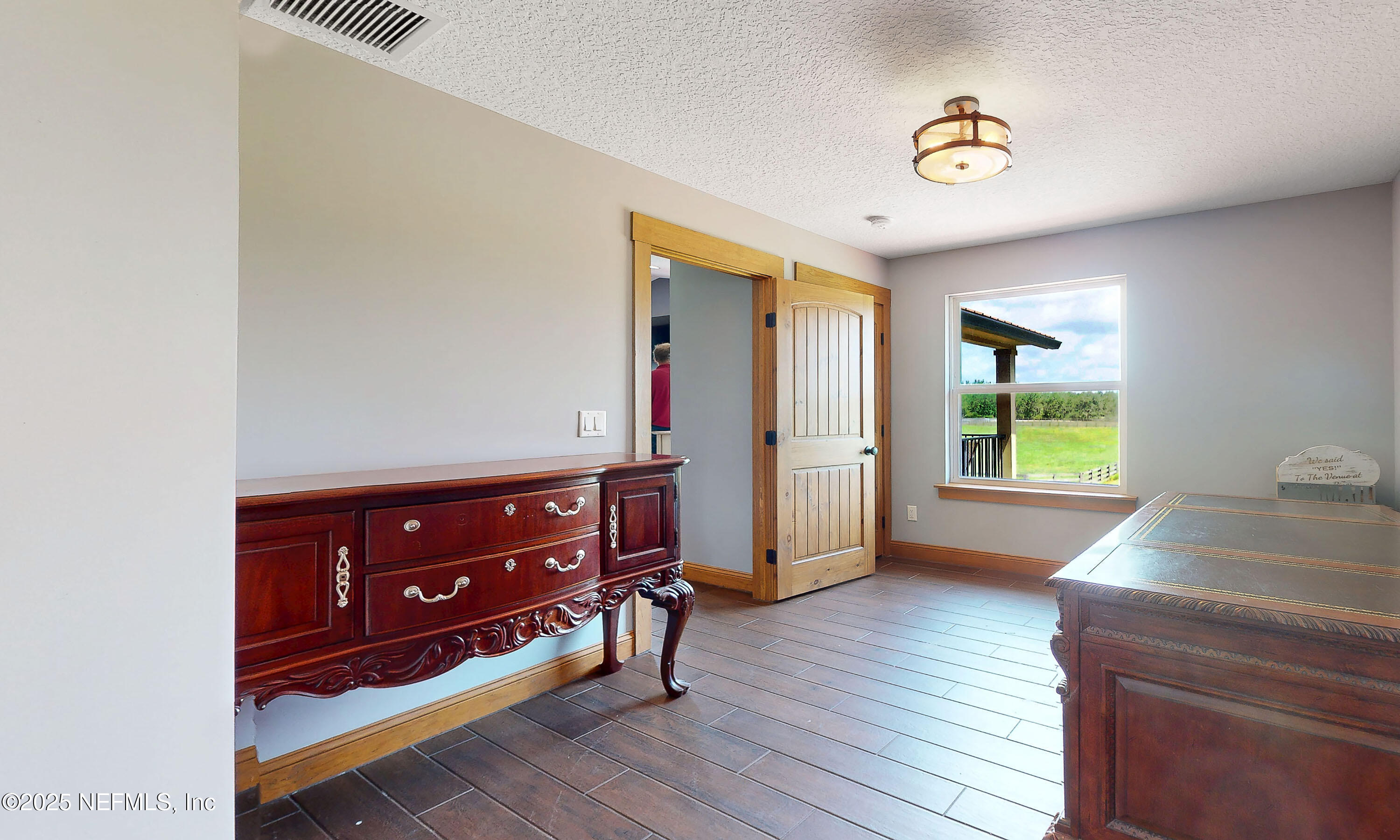 1845 Kinard Road Bryceville, FL 32009 - Photo 29 of 86 a room with a bed and a window