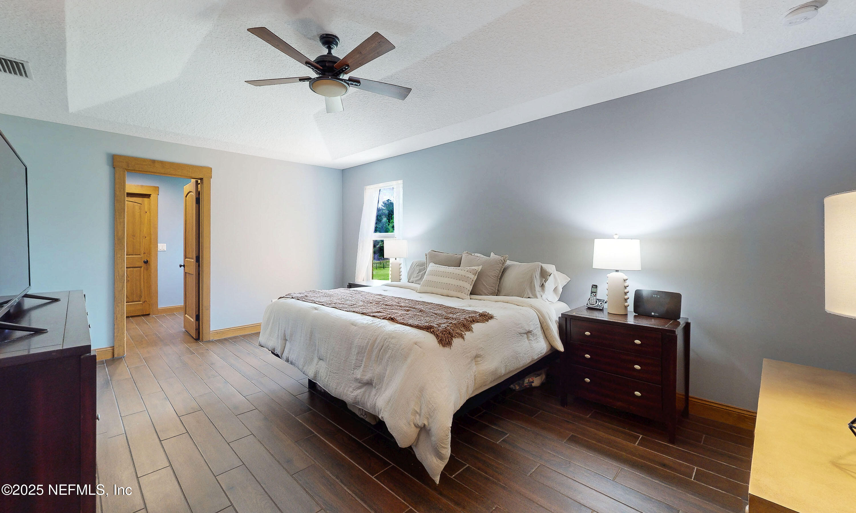 1845 Kinard Road Bryceville, FL 32009 - Photo 30 of 86 a bedroom with a bed and a table