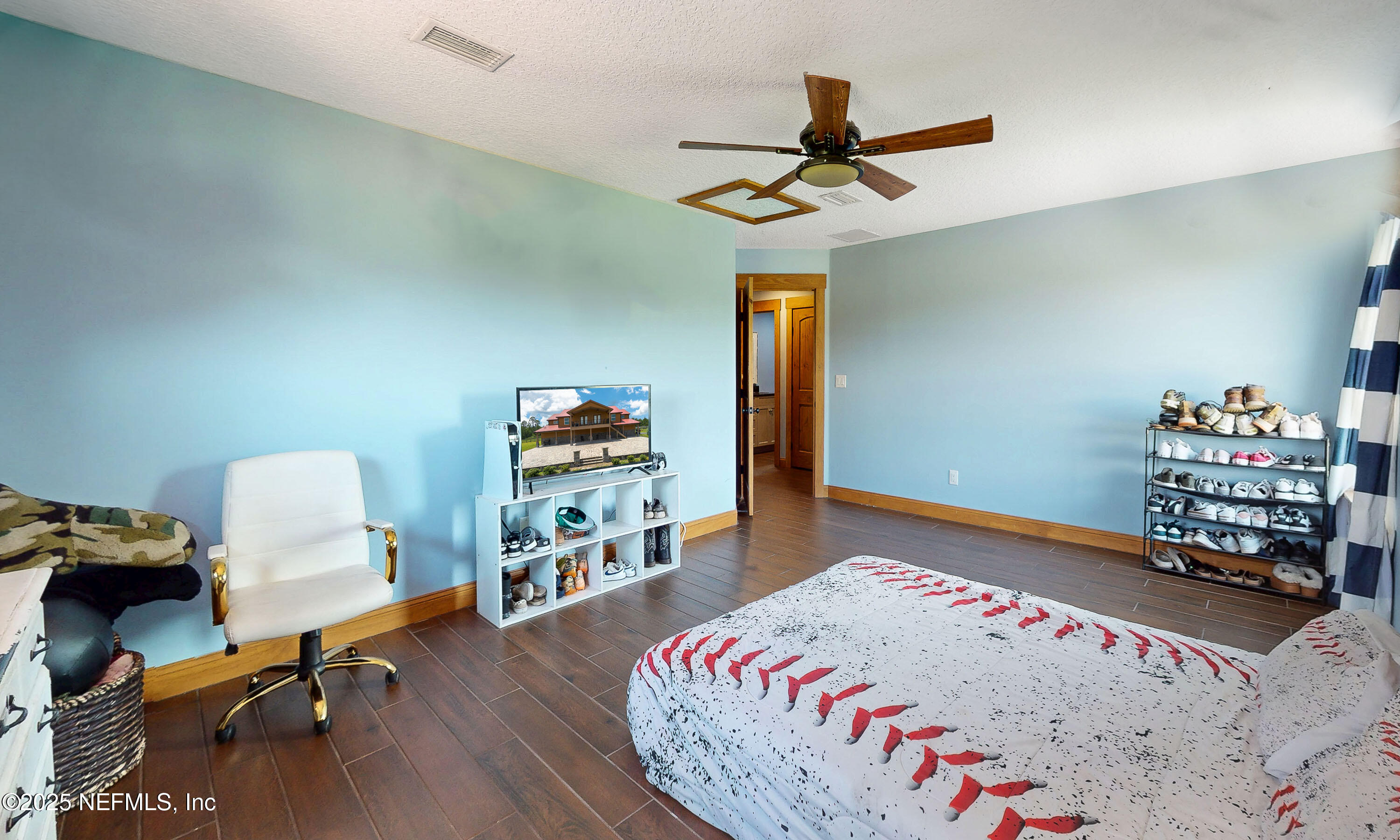 1845 Kinard Road Bryceville, FL 32009 - Photo 40 of 86 a bedroom with a bed and a chandelier