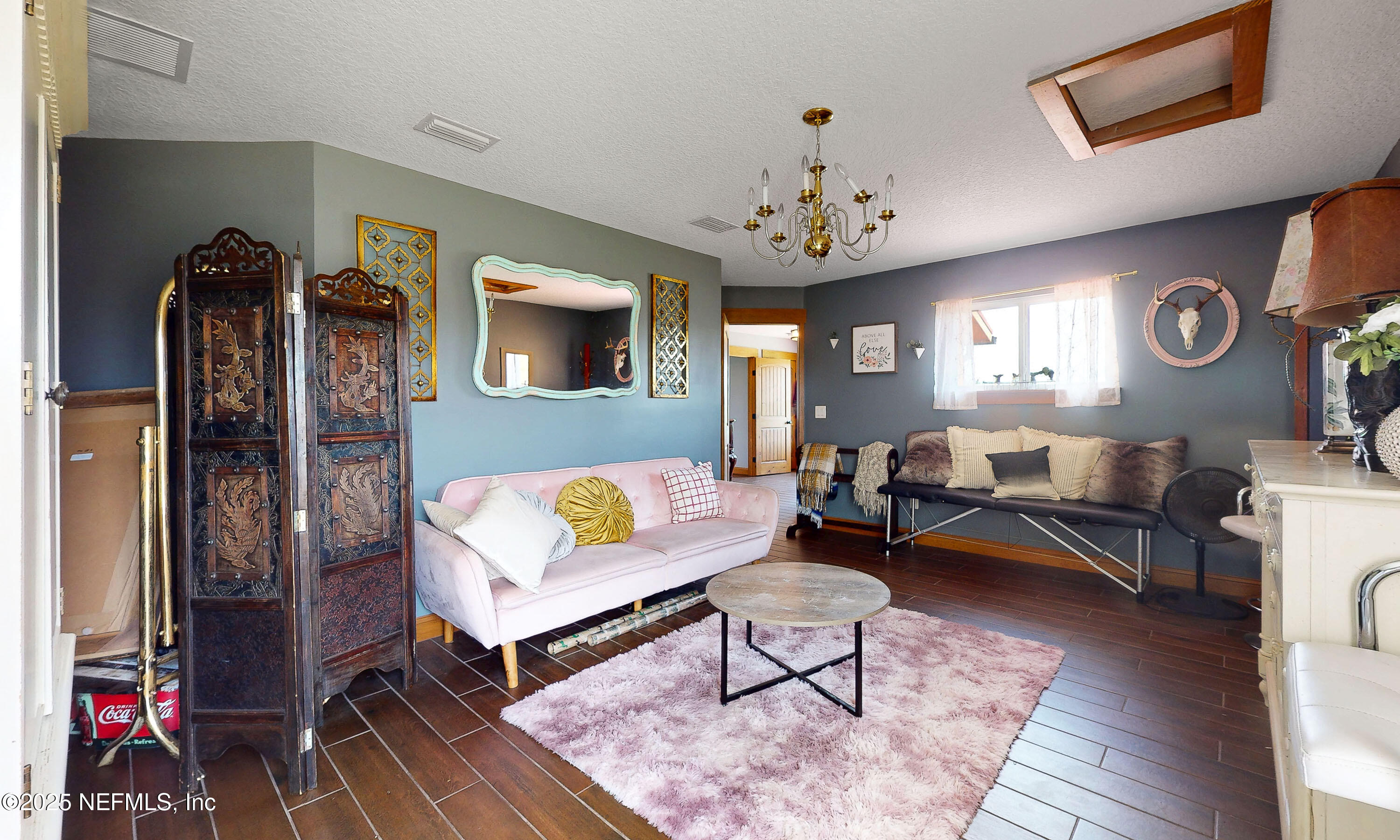 1845 Kinard Road Bryceville, FL 32009 - Photo 43 of 86 a living room with furniture a window and a clock