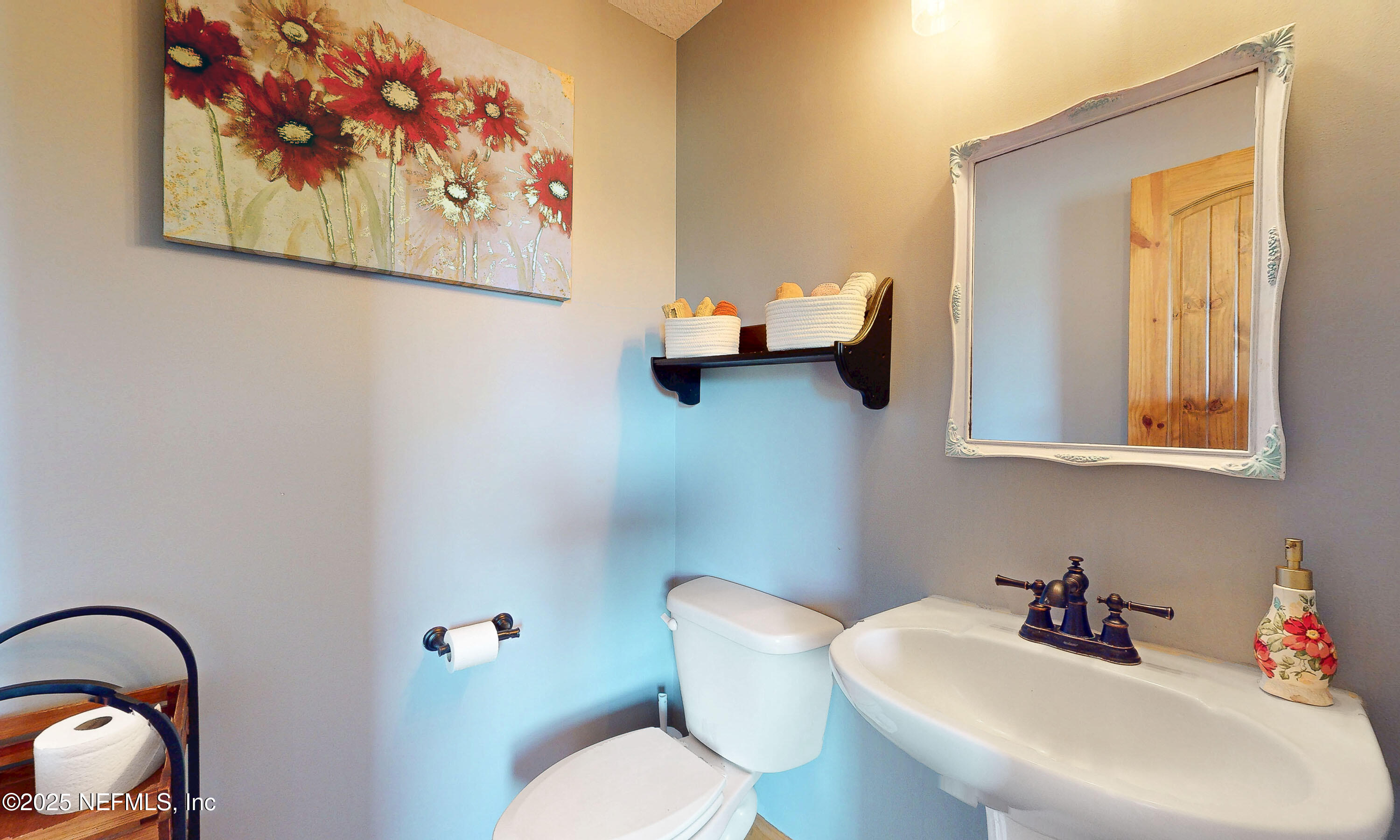 1845 Kinard Road Bryceville, FL 32009 - Photo 44 of 86 a bathroom with a toilet sink and mirror