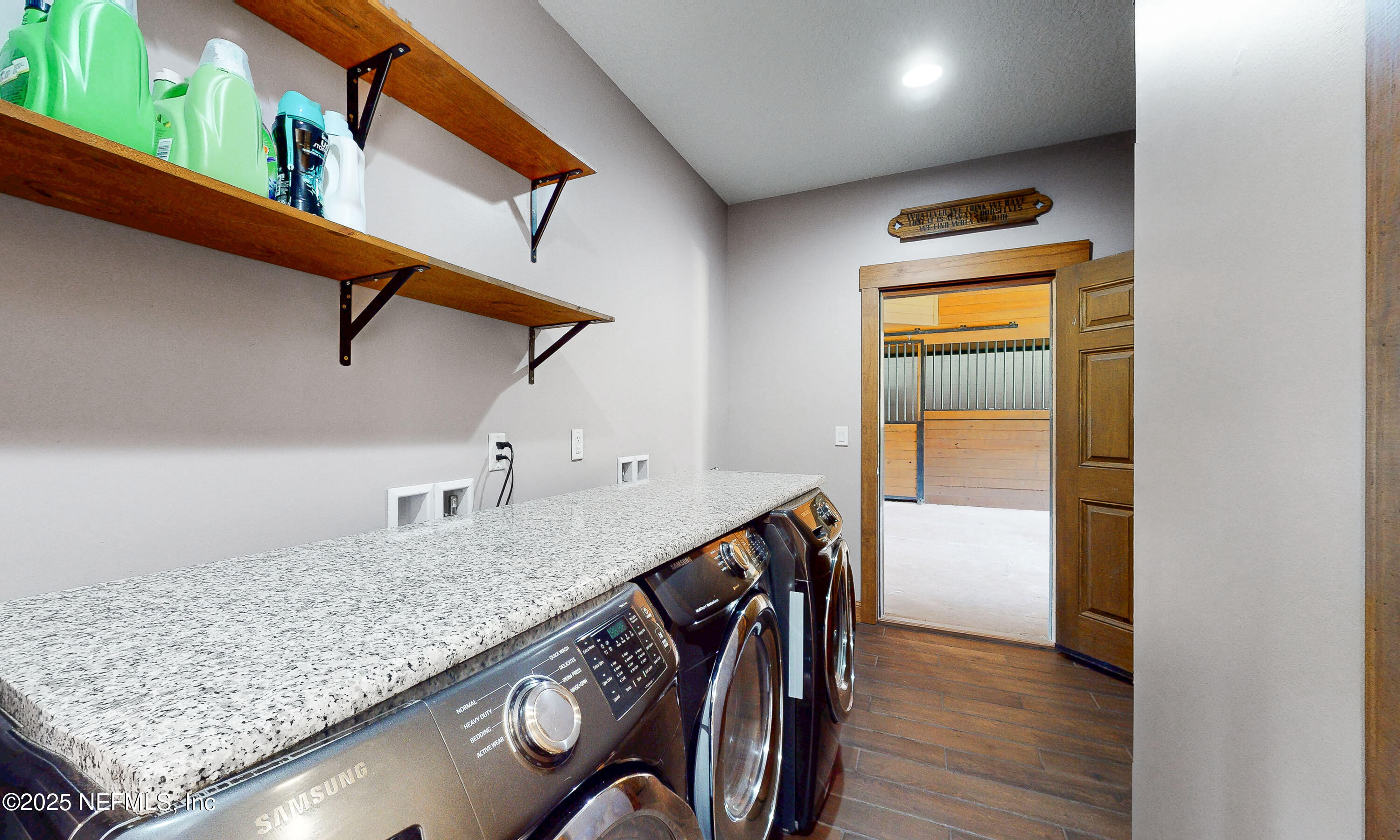 1845 Kinard Road Bryceville, FL 32009 - Photo 45 of 86 a kitchen with stainless steel appliances granite countertop a sink and wooden floor