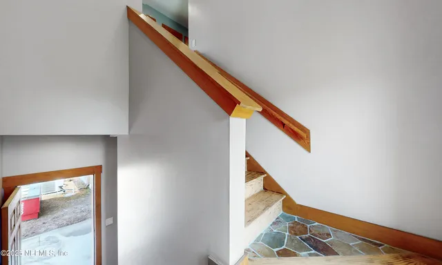 a backyard of a house with lots of green space and lake view