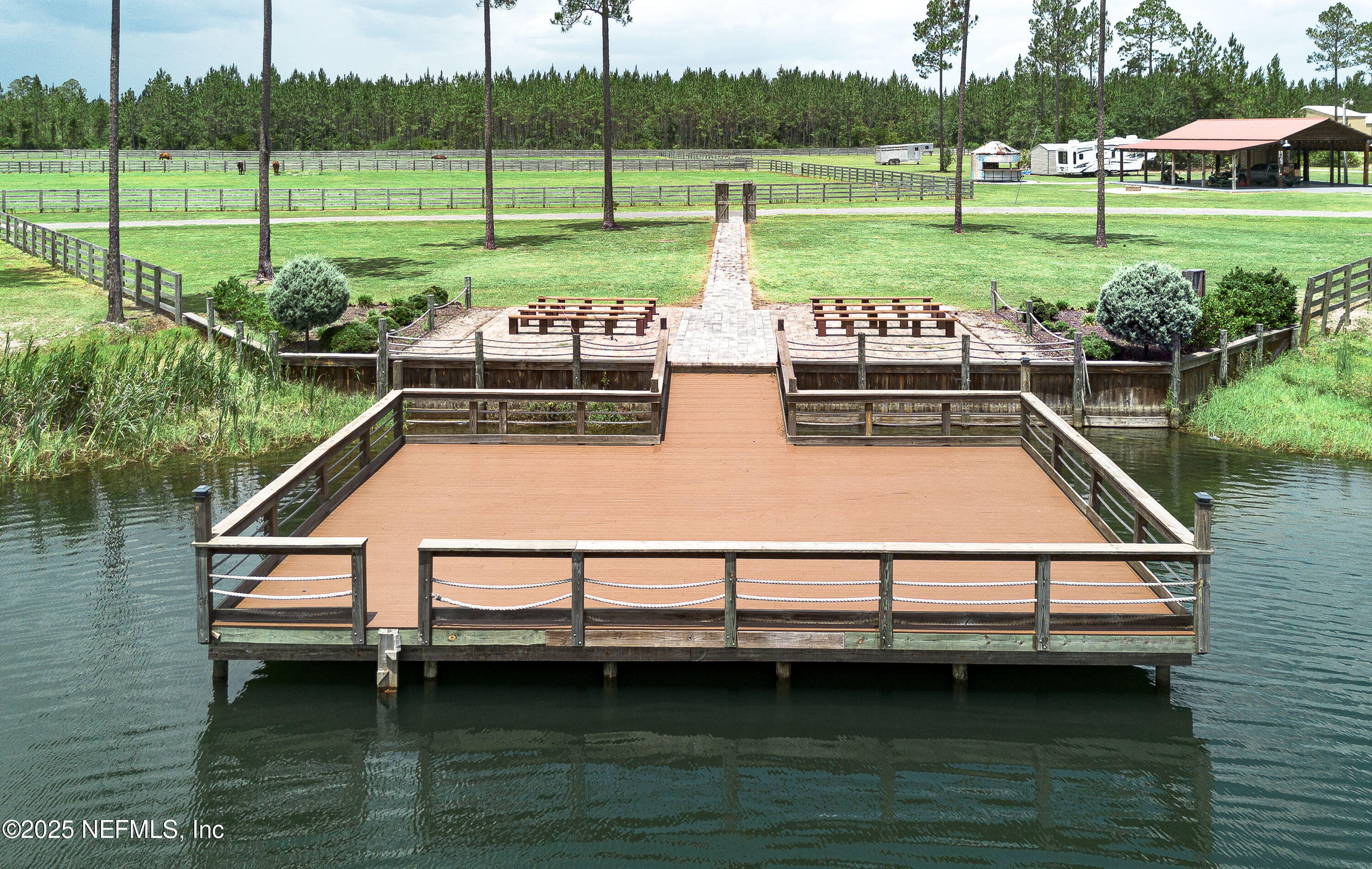 1845 Kinard Road Bryceville, FL 32009 - Photo 58 of 86 a view of a lake with a yard