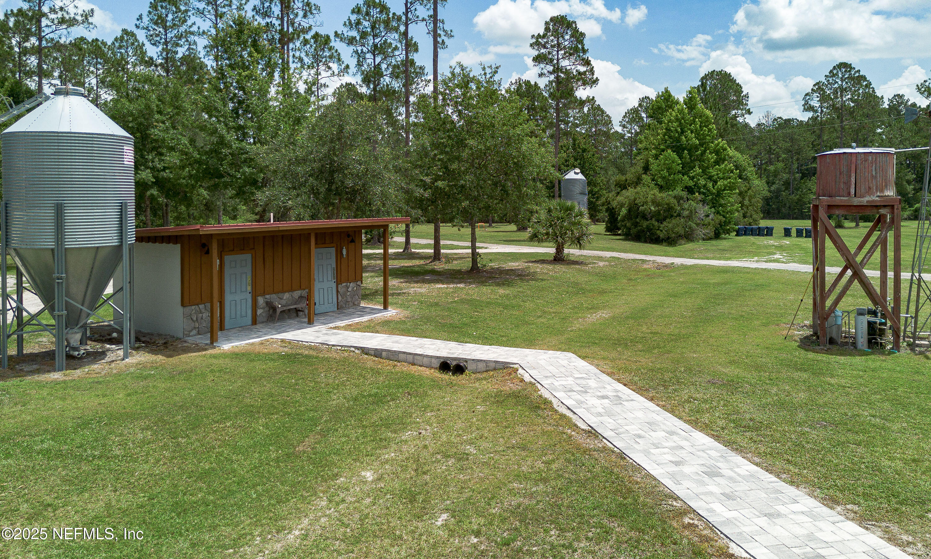 1845 Kinard Road Bryceville, FL 32009 - Photo 60 of 86 a view of a house with backyard and a slide