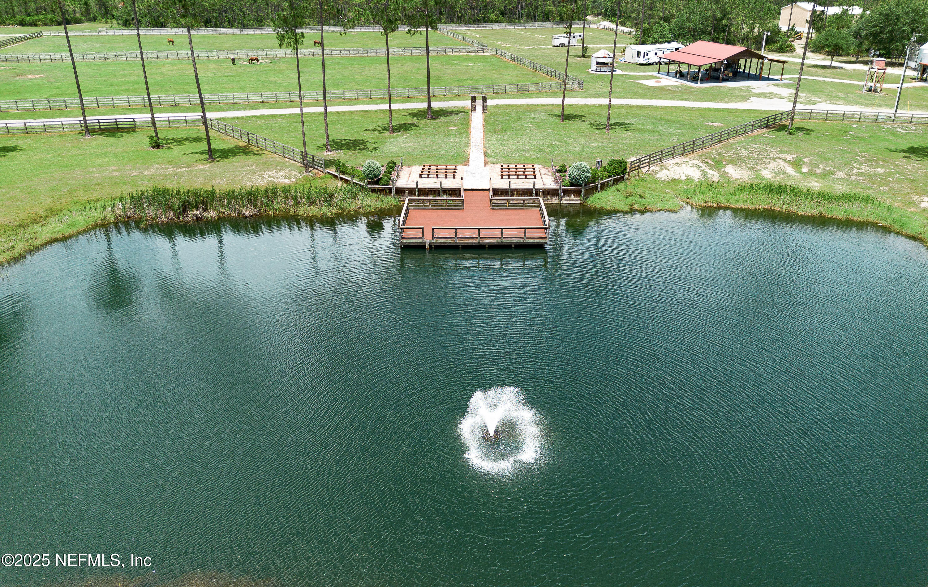 1845 Kinard Road Bryceville, FL 32009 - Photo 63 of 86 a view of a lake with a big yard