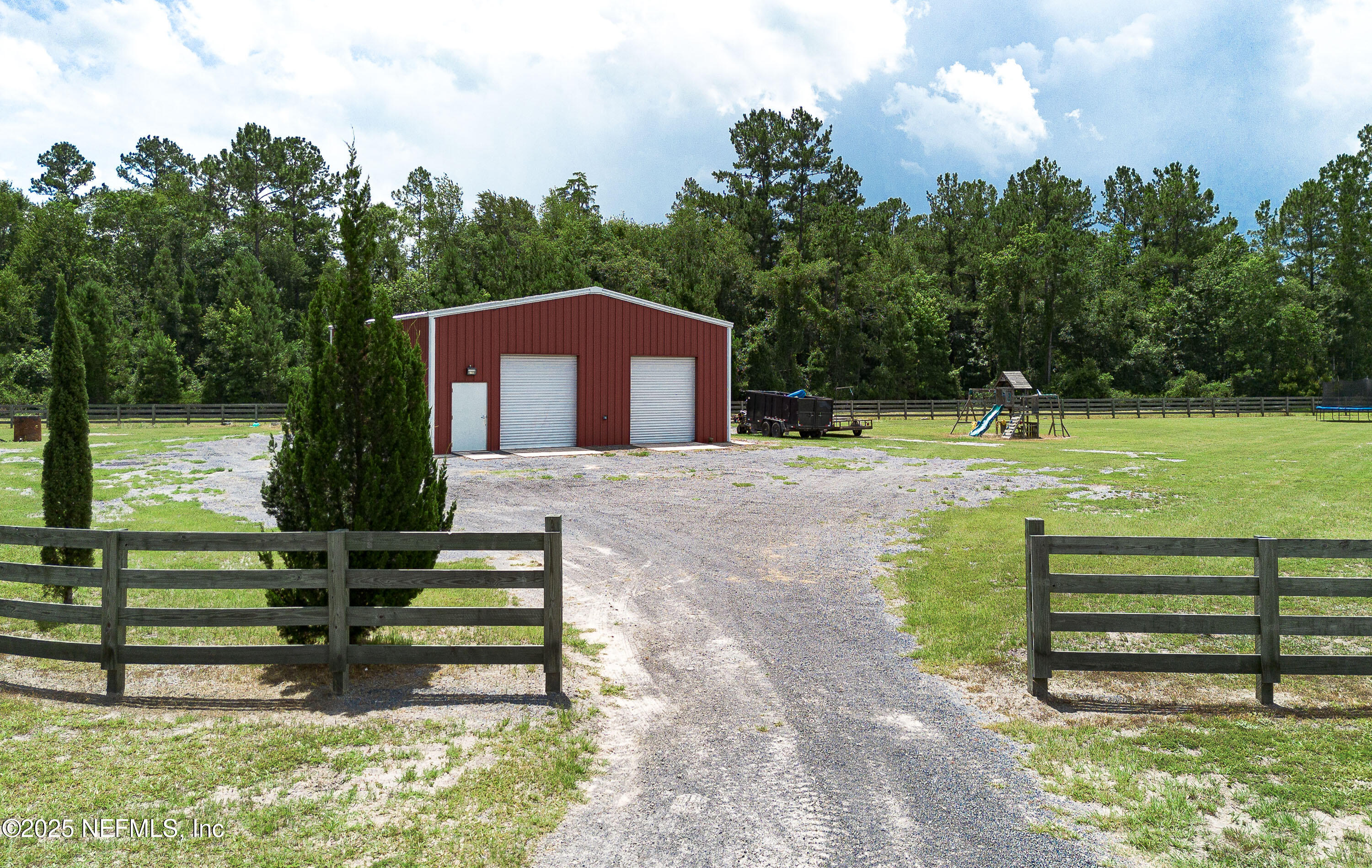 1845 Kinard Road Bryceville, FL 32009 - Photo 65 of 86 a front view of a house with a yard
