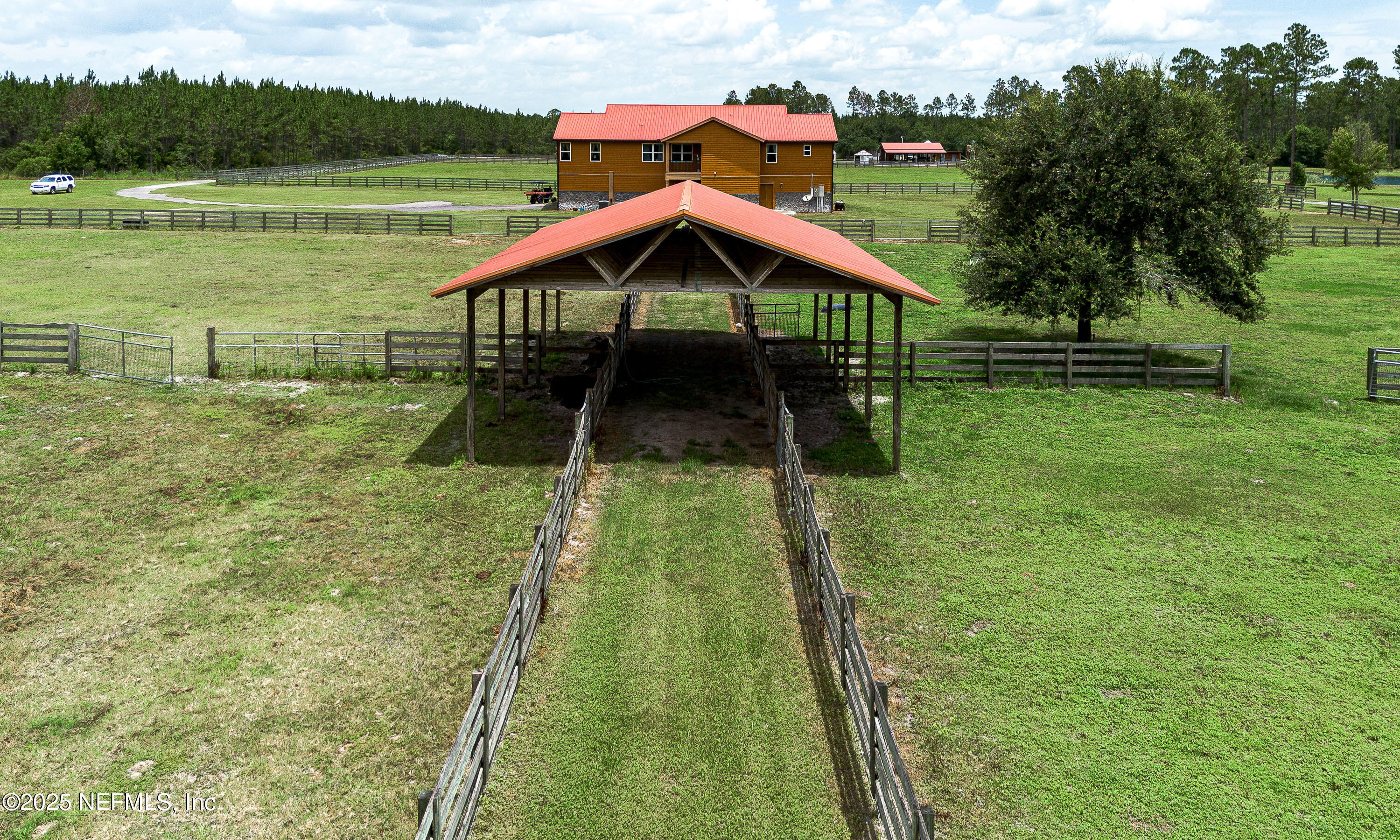 1845 Kinard Road Bryceville, FL 32009 - Photo 72 of 86 a backyard of a house with lots of green space and lake view