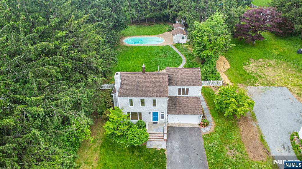 163 Sand Spring Road Morristown, NJ 07960 - Photo 31 of 39 an aerial view of a house with a yard and lake view