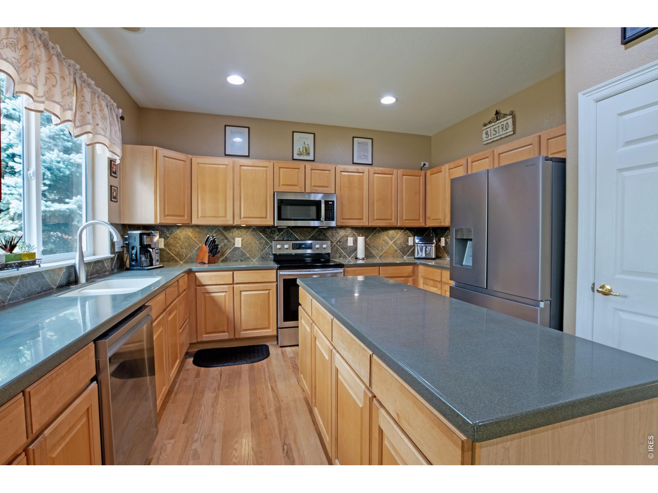 615 Americana Road Longmont, CO 80504 - Photo 12 of 47 Center island, corian countertops