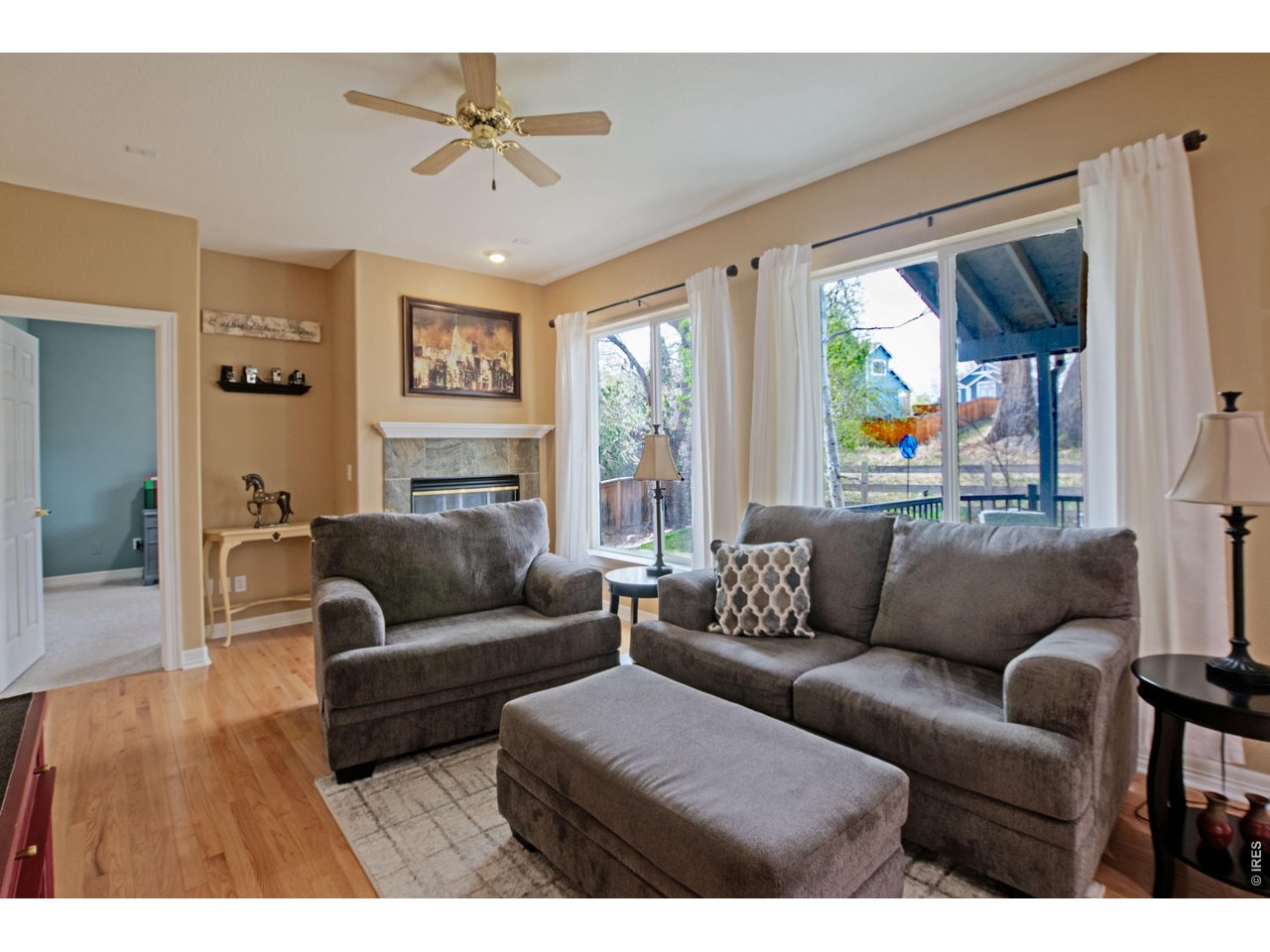 615 Americana Road Longmont, CO 80504 - Photo 16 of 47 Cozy family room with fireplace