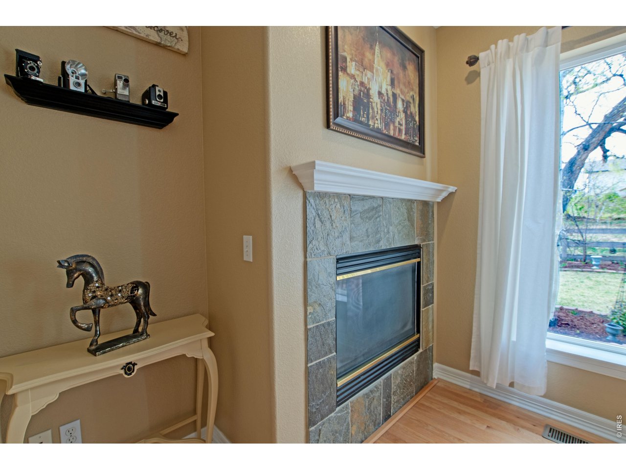 615 Americana Road Longmont, CO 80504 - Photo 18 of 47 Family room fireplace