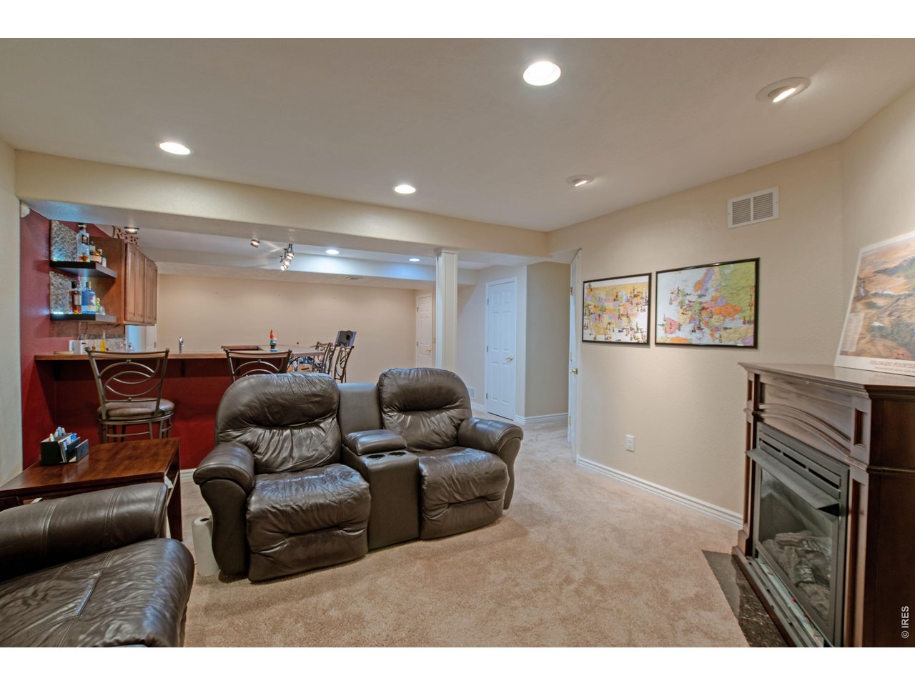 615 Americana Road Longmont, CO 80504 - Photo 32 of 47 Basement rec room with fireplace
