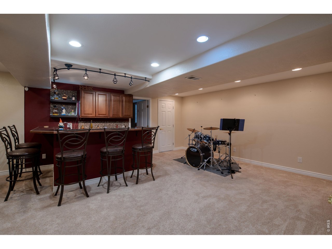 615 Americana Road Longmont, CO 80504 - Photo 34 of 47 Basement entertaining bar area