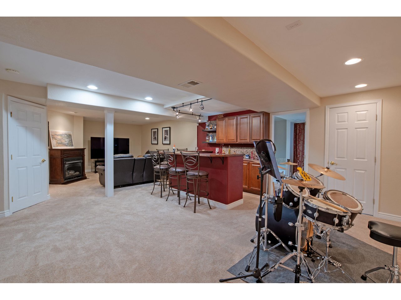 615 Americana Road Longmont, CO 80504 - Photo 35 of 47 Basement bar area and rec room
