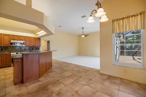 a view of a kitchen and a window