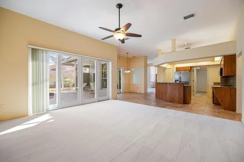an empty room with windows and closet