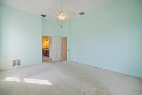 a bathroom with a tub a shower a sink and a large mirror