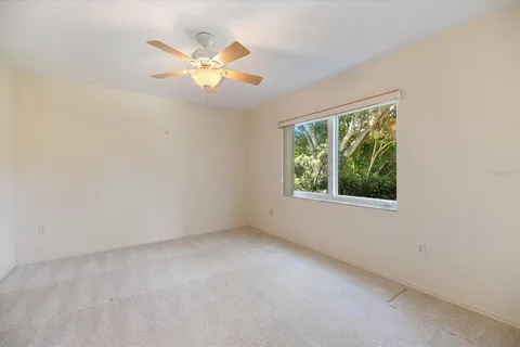 a view of a house with pool table and chairs