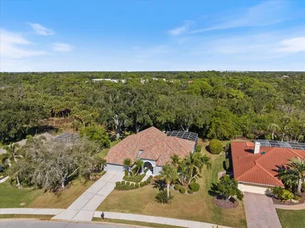 an aerial view of a house with a garden