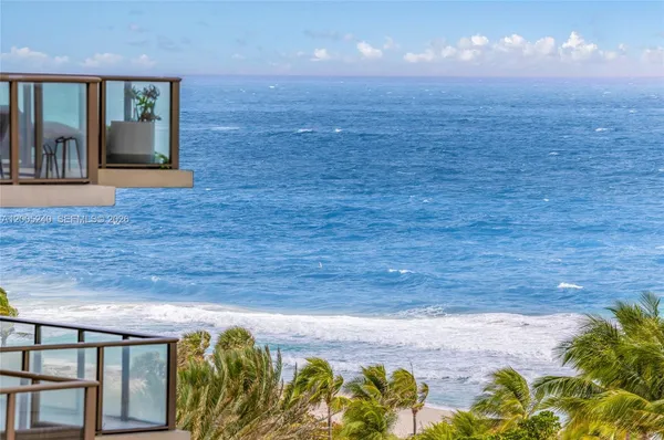 a spacious bedroom with a bed and a flat screen tv