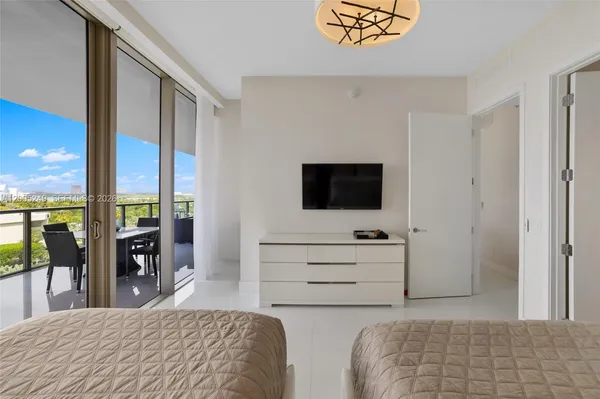 a living room with fireplace furniture and a flat screen tv