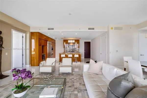 a kitchen with stainless steel appliances granite countertop a stove and a refrigerator