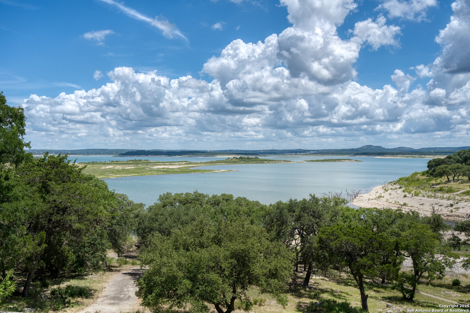 720 Five Oaks Canyon Lake, TX 78133 - Photo 1 of 1 a view of a lake with a yard