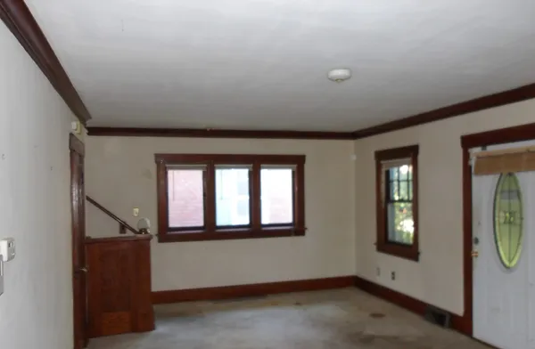 a view of an entryway with wooden floor