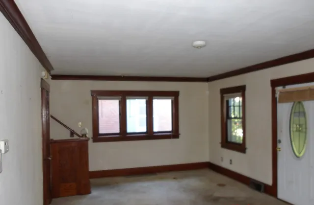 a view of an entryway with wooden floor