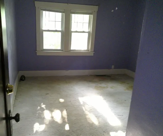 an empty room with a window