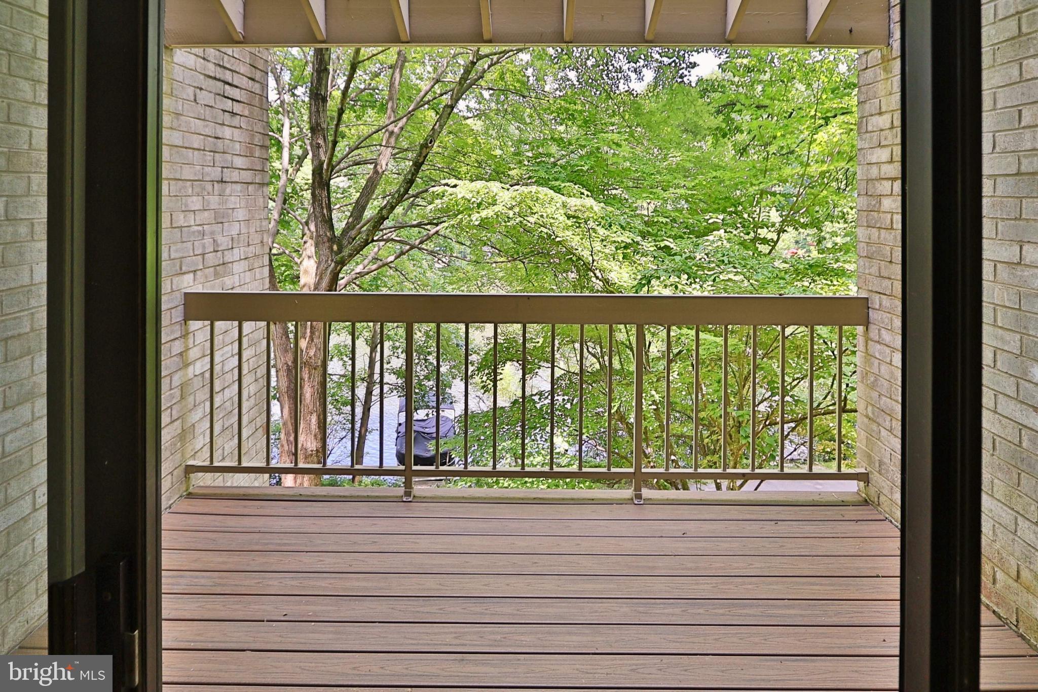 11108 Boathouse Court, Unit 97 Reston, VA 20191 - Photo 7 of 28 The deck with wooded summer views