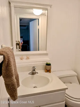 a view of living room with furniture and flat screen tv