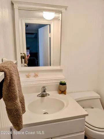 a view of living room with furniture and flat screen tv