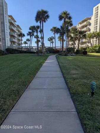 a front view of building with yard