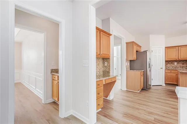 a view of a kitchen from the hallway