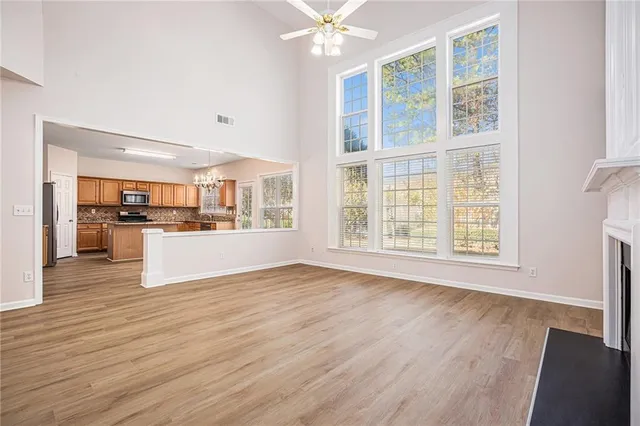 a view of kitchen with wooden floor and window