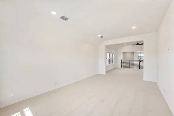 a view of a kitchen and a refrigerator