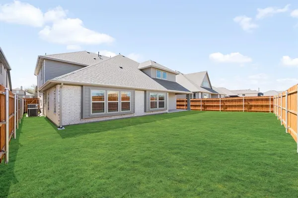 a view of a house with a big yard
