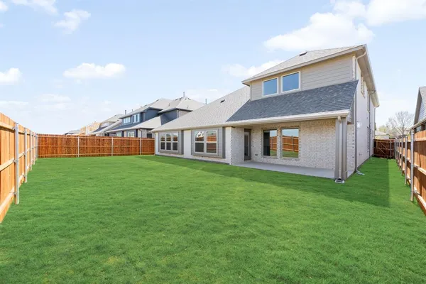 a view of a yard in front of a house with a yard
