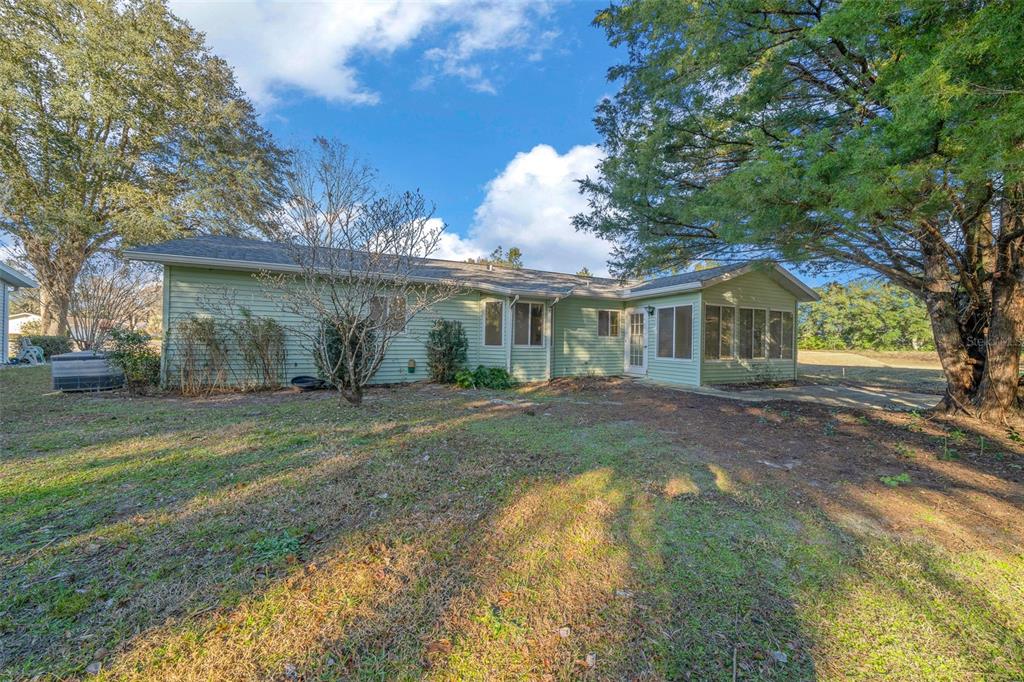 7556 Southwest 112th Lane Ocala, FL 34476 - Photo 37 of 37 a view of a house with a yard