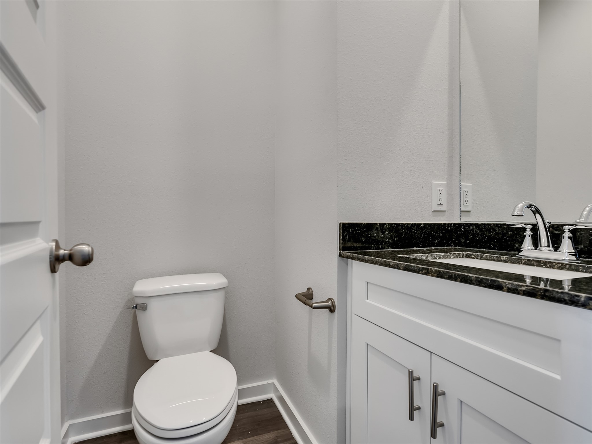 1206 Elsinore Drive Rosharon, TX 77583 - Photo 9 of 21 a white toilet sitting next to a sink