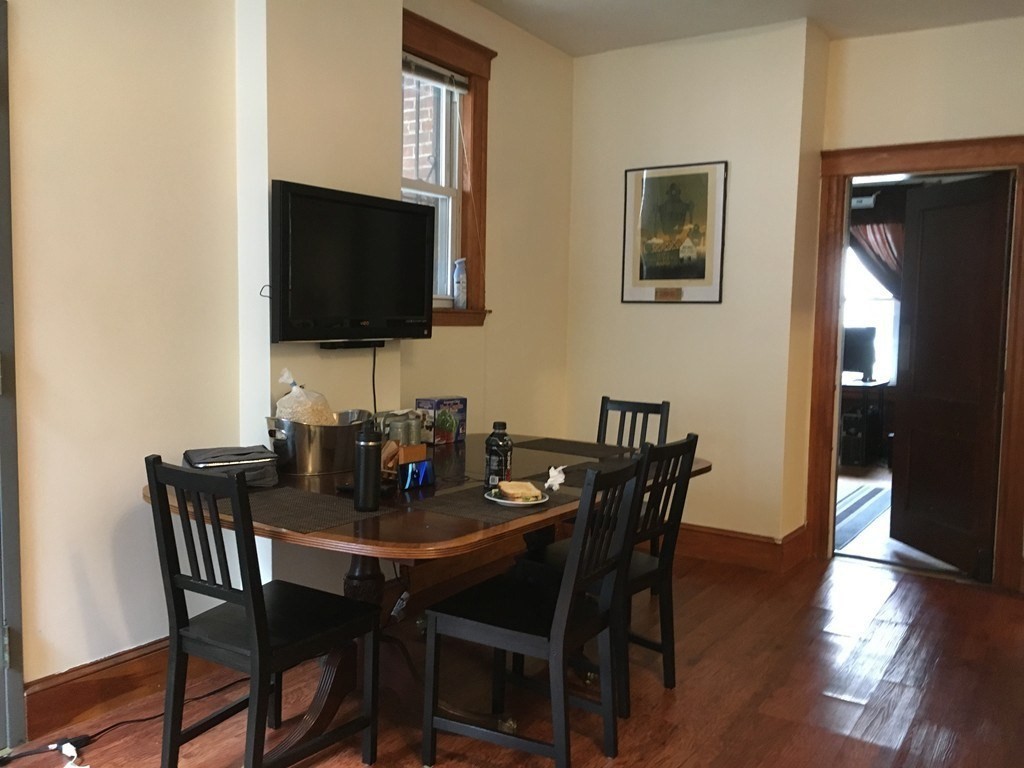 20 St Lukes Road, Unit 1 Boston, MA 02134 - Photo 8 of 10 a dining room with furniture and wooden floor