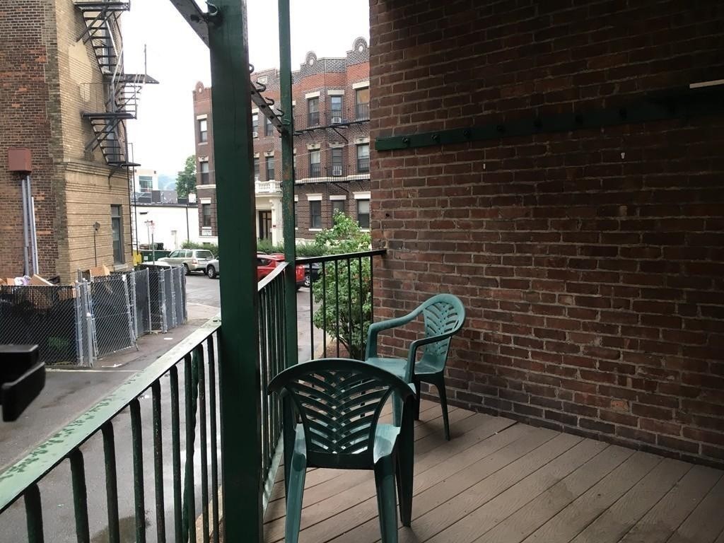20 St Lukes Road, Unit 1 Boston, MA 02134 - Photo 9 of 10 a view of a balcony with chairs