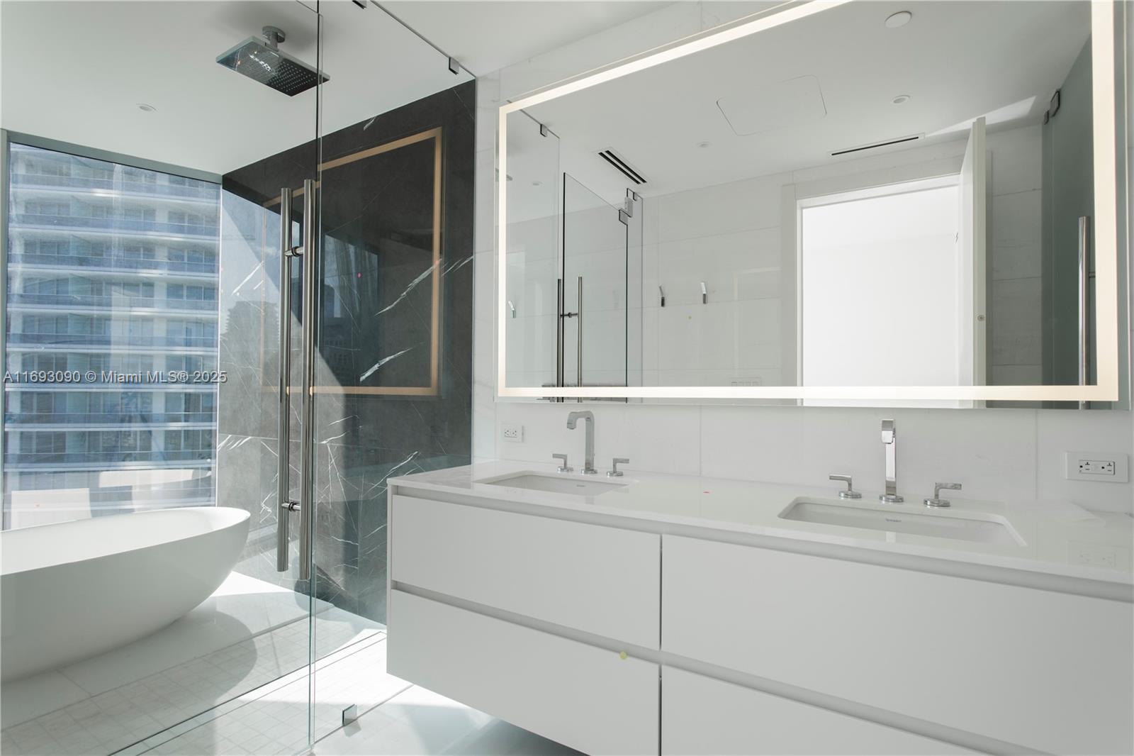 300 Biscayne Blvd Way, Unit 3307 Miami, FL 33131 - Photo 19 of 59 a bathroom with a sink toilet and shower