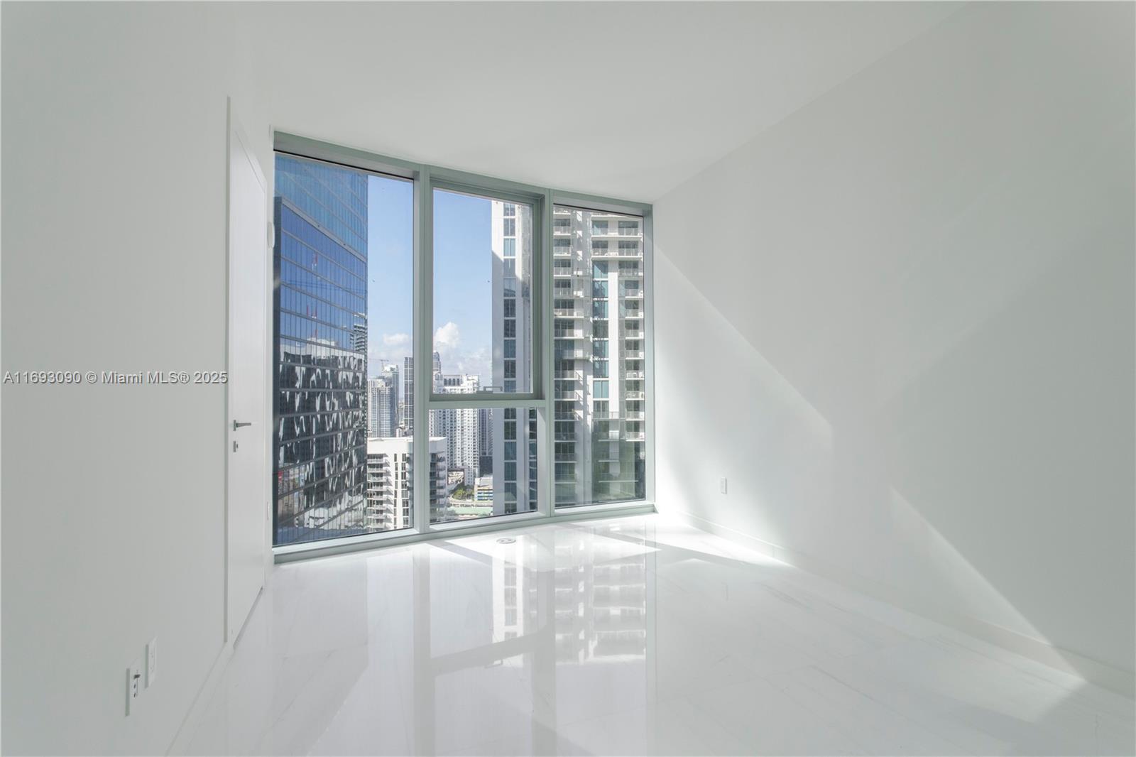 300 Biscayne Blvd Way, Unit 3307 Miami, FL 33131 - Photo 22 of 59 a view of an empty room with a window