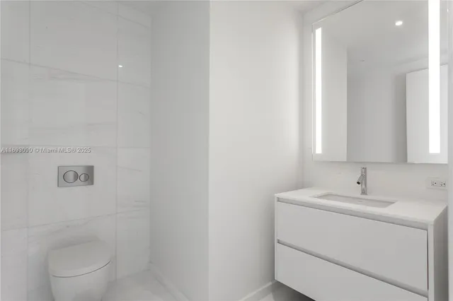 a living room with furniture and large windows