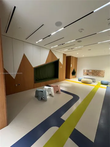 a living room with a large window and a table