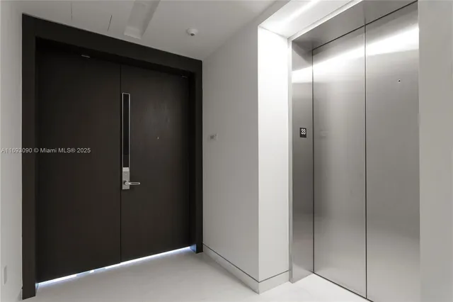 a bedroom with a bed and a view of bathroom